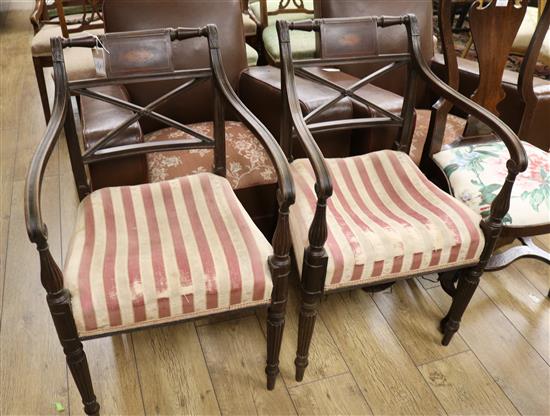A pair of Regency elbow chairs